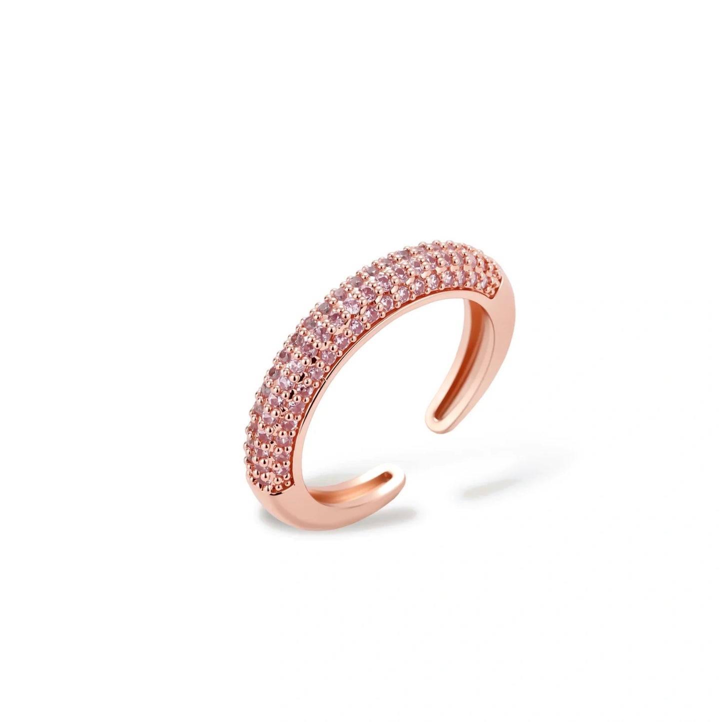 Rose gold jewelry set with pavé cubic zirconia stones including curved necklace, hoop earrings, and adjustable ring on cream background.