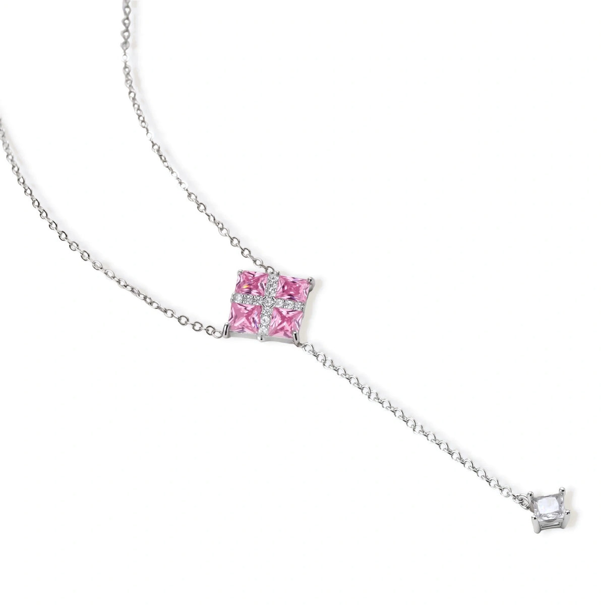 Pink Prism Cross Set — side angle view of white gold-plated necklace and earrings