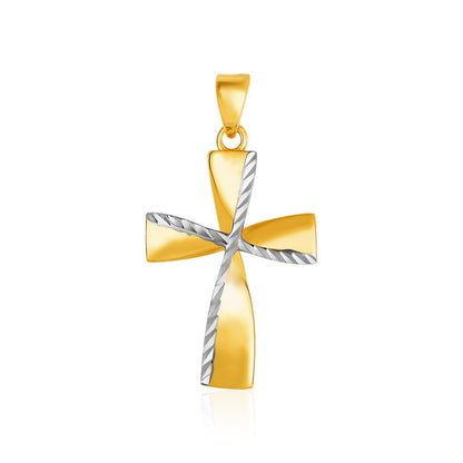Gold and silver cross pendant on a white background