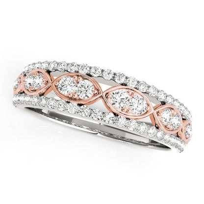 Rose gold and silver ring with diamond accents on a white background