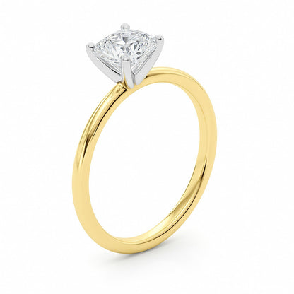 Gold ring with a diamond on a white background