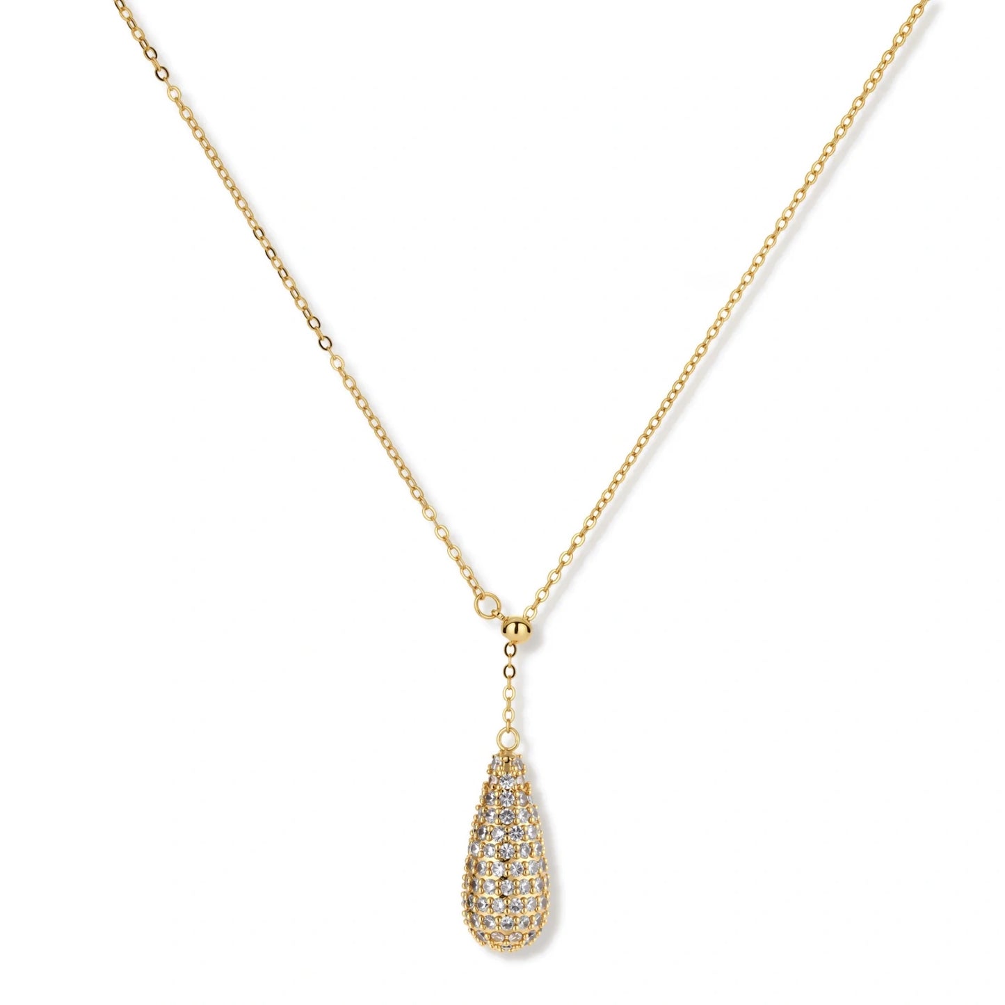 Gold-plated teardrop necklace and earrings covered in AAA cubic zirconia crystals on cream background.