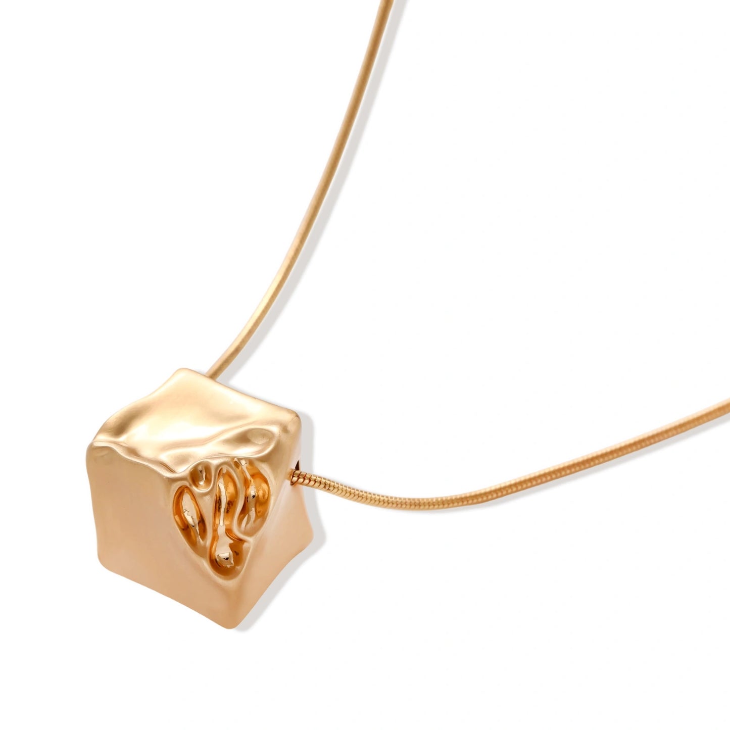 Modern cube pendant with liquid metal draping detail on adjustable chain, available in gold and silver finishes