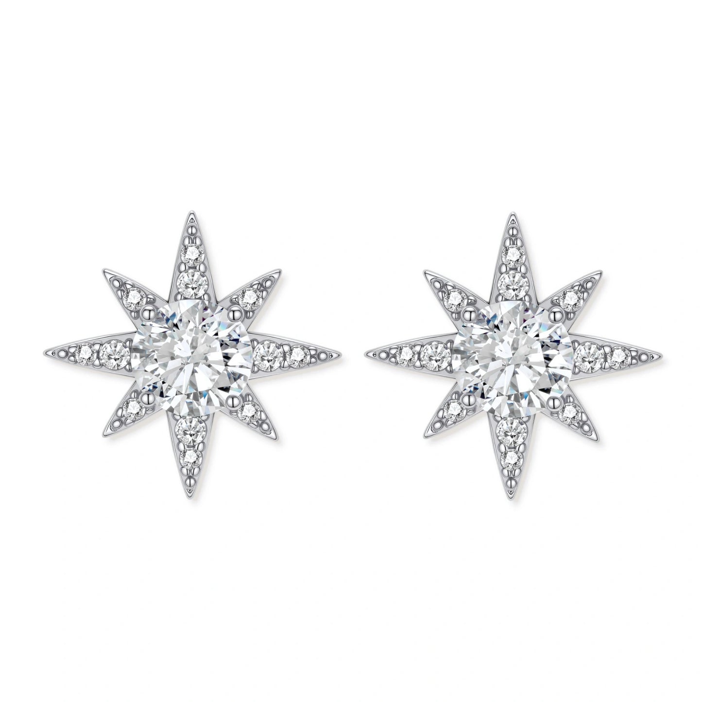 Sterling silver star-shaped stud earrings with brilliant moissanite center stones and pavé details on neutral background.