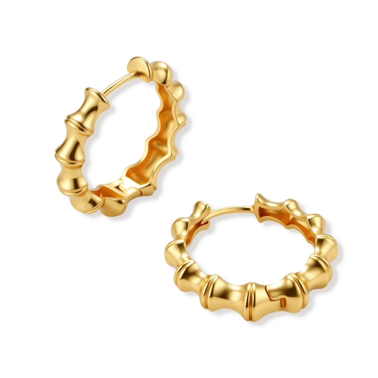 Close-up of gold-plated sterling silver hoop earrings with bamboo-inspired segmented design on white background.