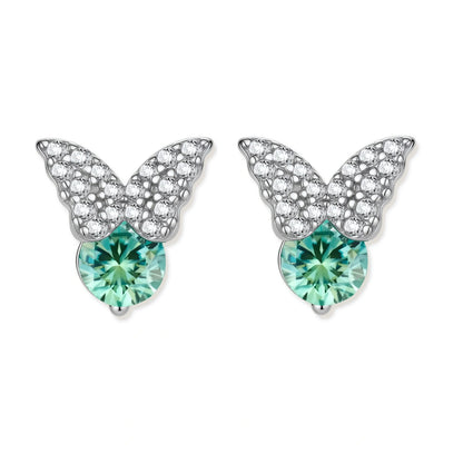 Sterling silver butterfly stud earrings with crystal wings and mint green center stones on cream background.