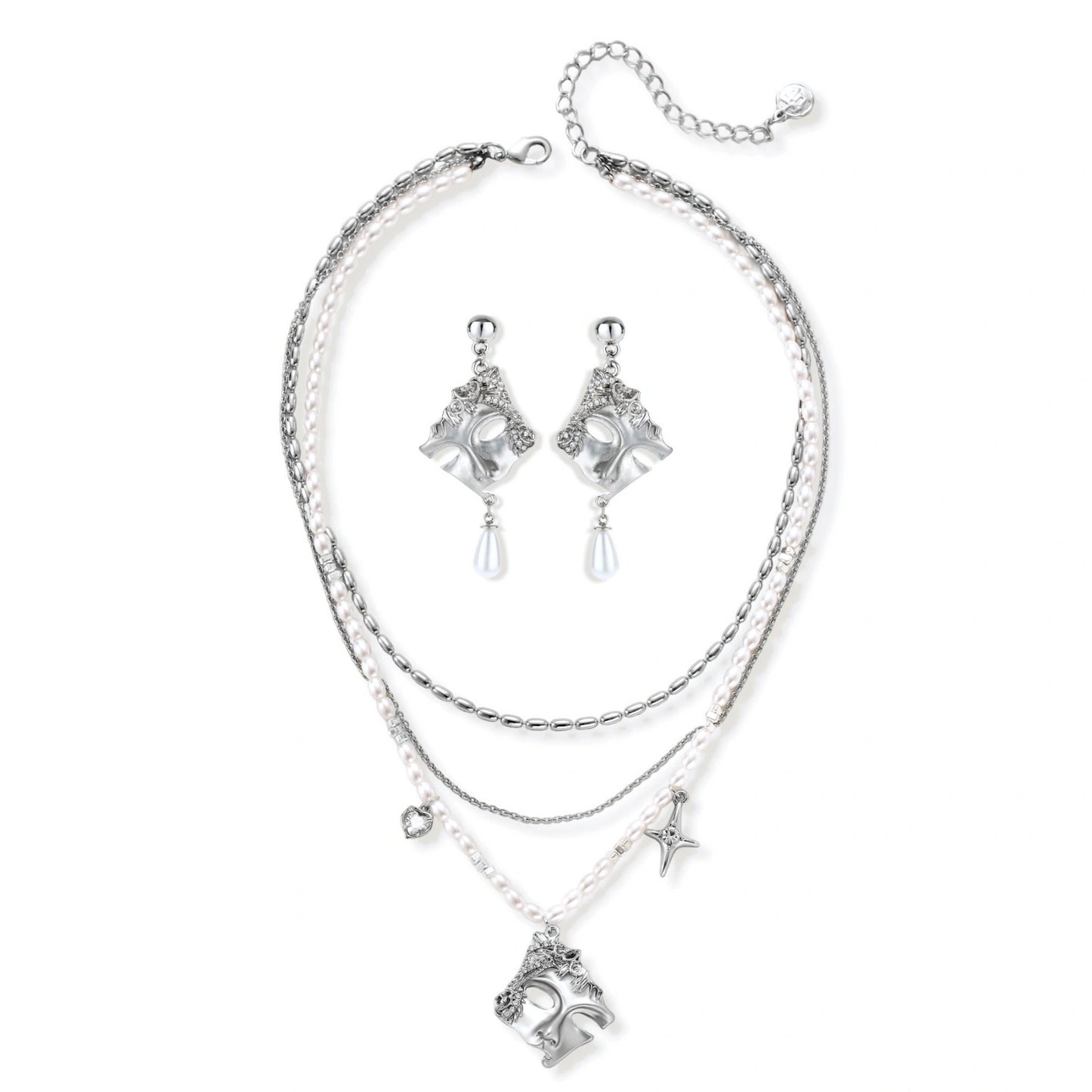 Ornate silver-toned masquerade mask jewelry set featuring rhinestone details and pearl drop earrings on white background.