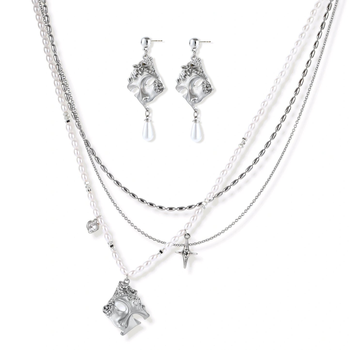 Ornate silver-toned masquerade mask jewelry set featuring rhinestone details and pearl drop earrings on white background.