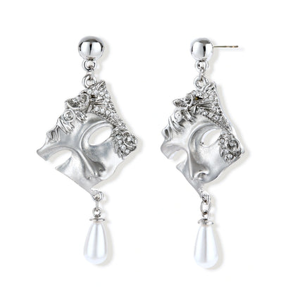 Ornate silver-toned masquerade mask jewelry set featuring rhinestone details and pearl drop earrings on white background.
