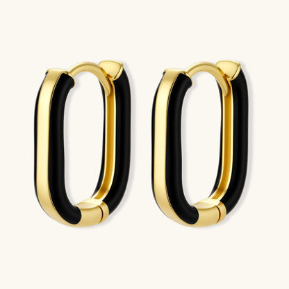 Modern hoop earrings with gold-plated and black sections, featuring hinged closure on white background.