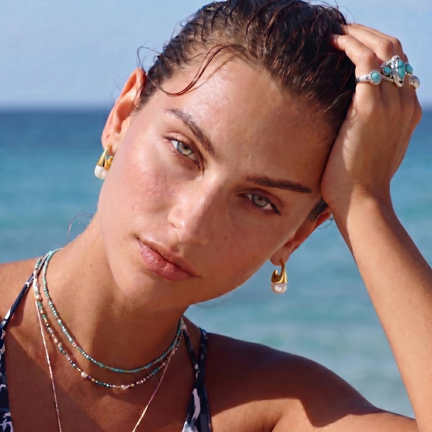 Model showing off earrings