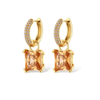14K gold plated jewelry set featuring square champagne CZ stones with sparkling huggie earrings on cream background.