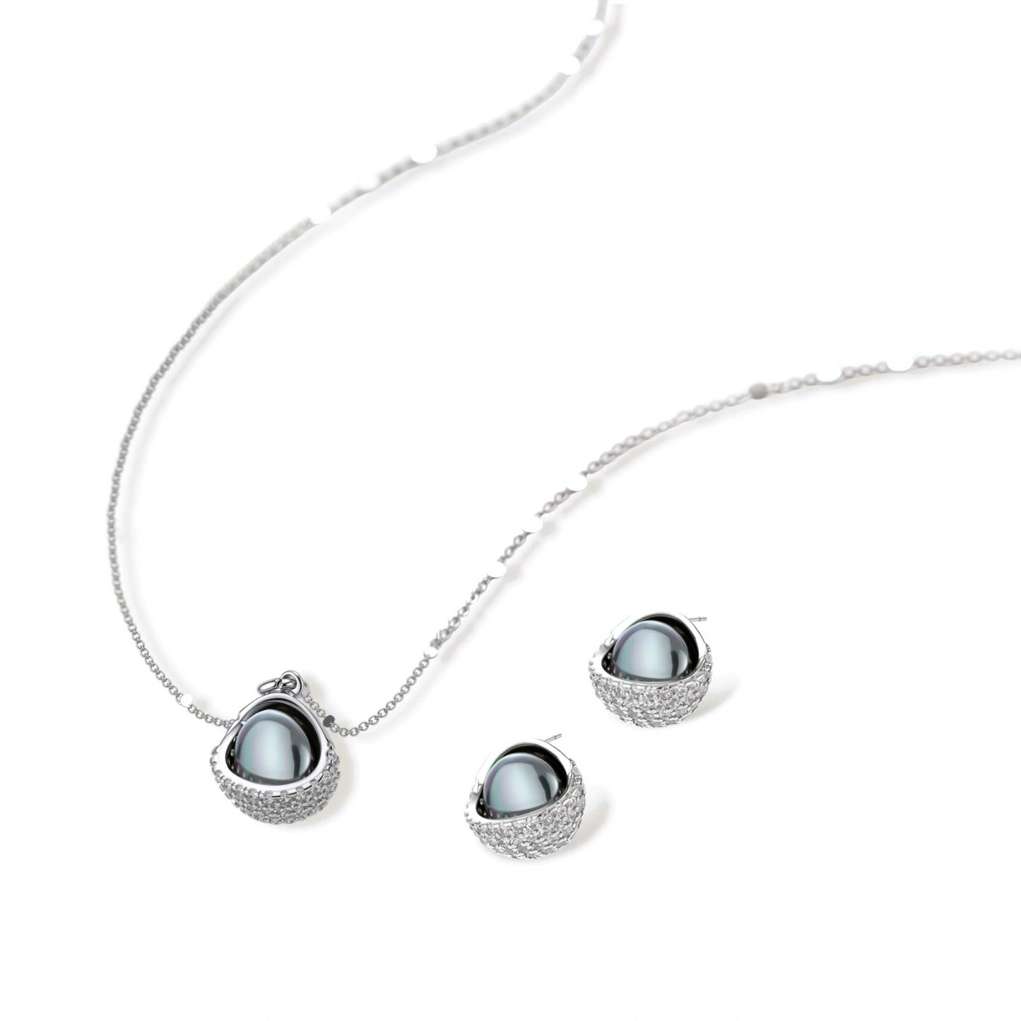 Silver gray Tahitian-style pearl pendant necklace and matching pave zirconia stud earrings set on cream background.