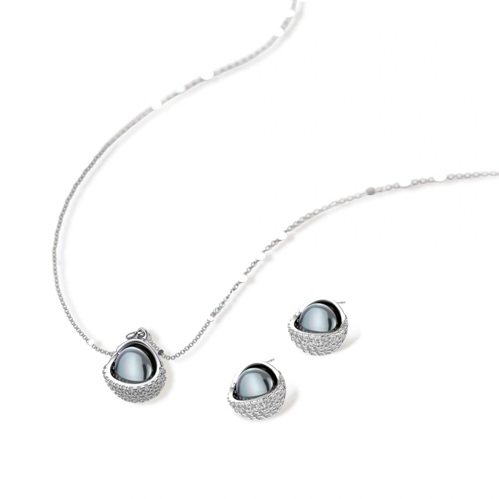 Silver gray Tahitian-style pearl pendant necklace and matching pave zirconia stud earrings set on cream background.