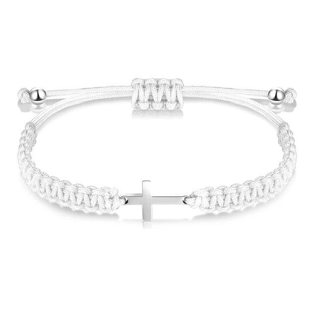 Black and white woven cross bracelets laid flat — couple bracelet set