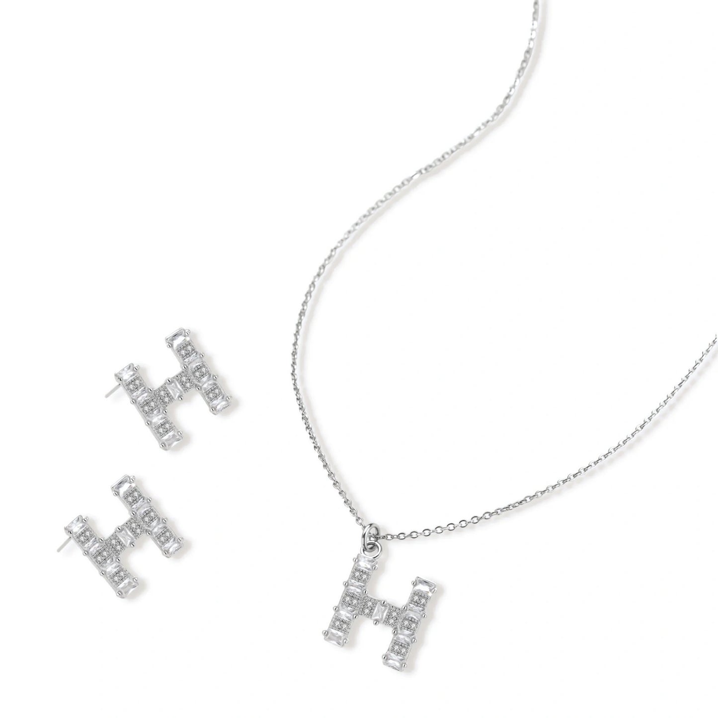 Letter H jewelry set featuring geometric crystal design in gold and white gold plated finish with adjustable chain necklace