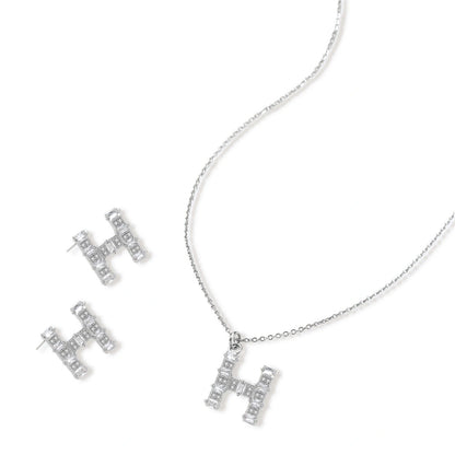 Letter H jewelry set featuring geometric crystal design in gold and white gold plated finish with adjustable chain necklace