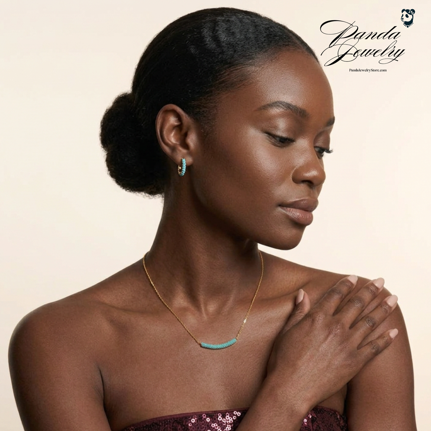 Woman wearing a necklace with a plain background