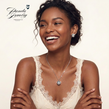 Cosmic Sphere set worn — white gold-plated CZ pavé sphere necklace and earrings lifestyle shot