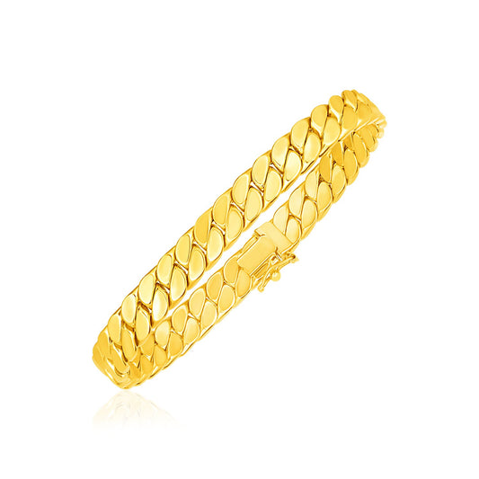 14K gold curb chain bracelet — 12.4g, 8-inch length worn on wrist