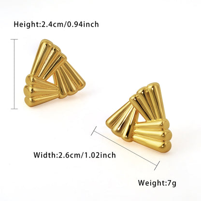 Gold geometric earrings with measurements on a white background