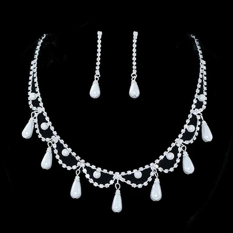 Elegant bridal pearl and rhinestone necklace set with matching earrings for weddings.
