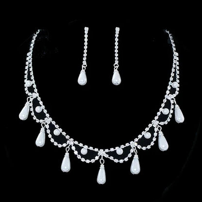 Elegant bridal pearl and rhinestone necklace set with matching earrings for weddings.
