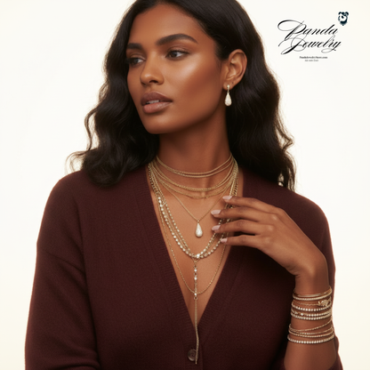 Golden Luxe Crystal Set layered styling — gold CZ necklace and earrings on bright background