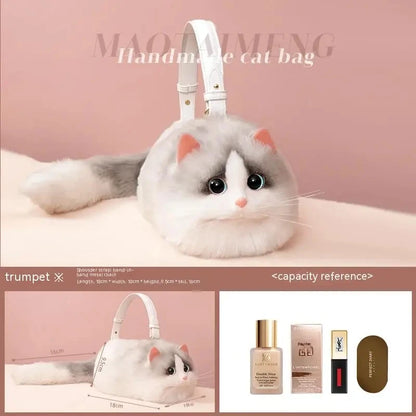 Handmade fluffy cat shoulder bag with big eyes and soft tail on pink background"