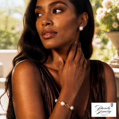 Woman wearing Pearl Embrace Studs with pearl and gold jewelry against a scenic background — freshwater pearl stud earrings in gold-plated setting by Panda Jewelry Store